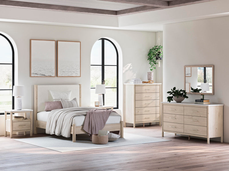 Ashley Furniture Cadmori upholstered bed with beige fabric and tufted headboard, shown in a modern bedroom setting.