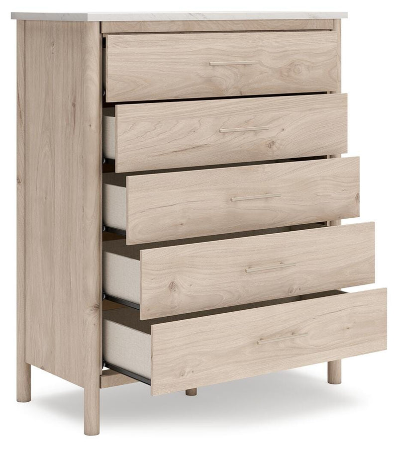 Open angle view of Ashley Furniture Cadmori Chest of Drawers showcasing its wooden finish and multiple drawers for storage.