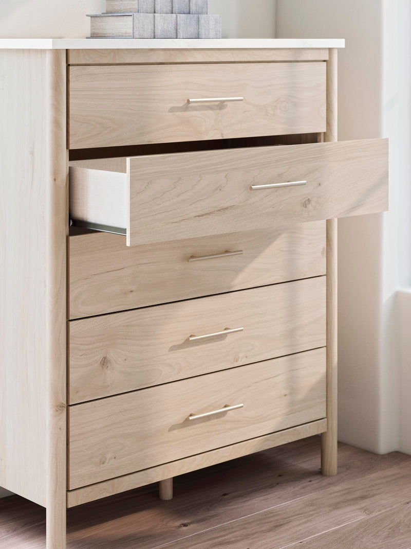 Ashley Furniture Cadmori chest of drawers with a sleek wooden finish and modern hardware, detailed close-up image.