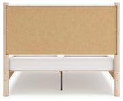 Ashley Furniture Cadmori upholstered bed with plush fabric headboard and frame, shown from the back view.