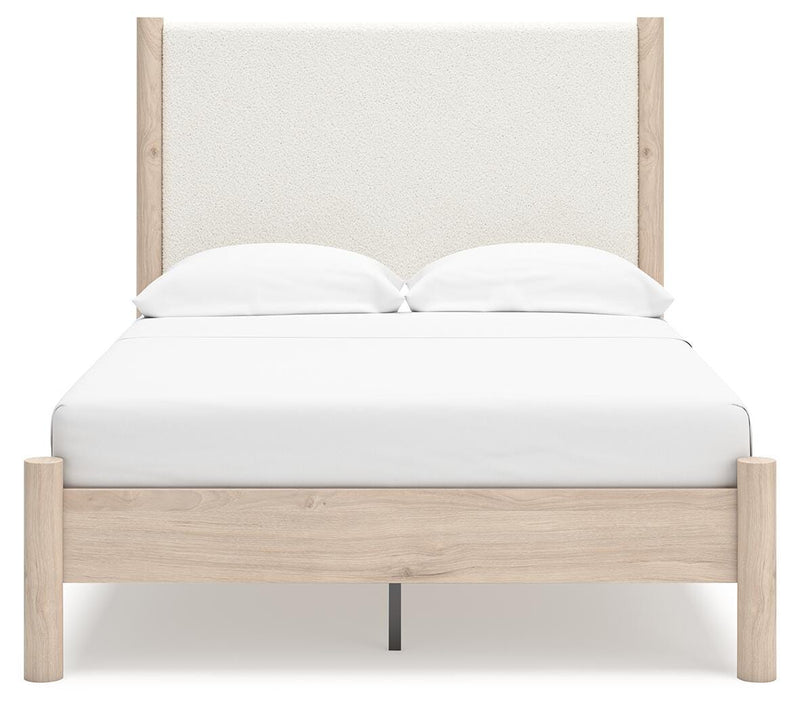 Ashley Furniture Cadmori upholstered bed with a padded headboard and elegant fabric finish, shown in a head-on view.