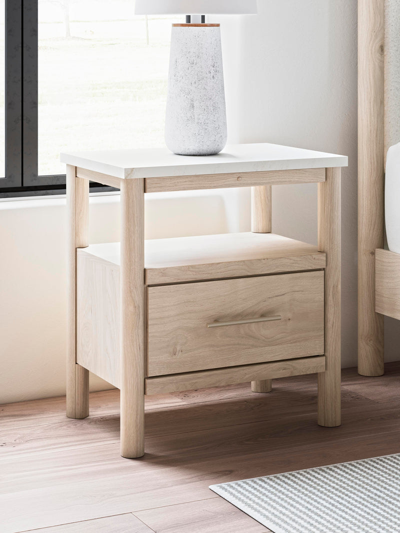 Ashley Furniture Cadmori nightstand with a dark wood finish and modern design, featuring a single drawer and open shelf.