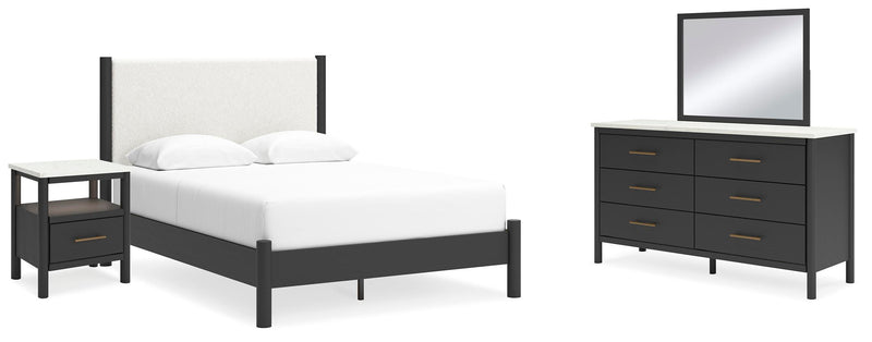 Ashley Furniture Cadmori bedroom set with a bed frame, matching nightstands, and dresser in a modern bedroom design.