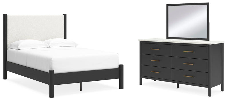 Ashley Furniture Cadmori bedroom set featuring a bed frame, matching nightstands, and dresser in a modern bedroom design.
