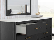 Ashley Furniture Cadmori bedroom set with a modern bed frame, nightstands, and matching dresser in a stylish bedroom arrangement.