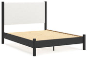 Ashley Furniture Cadmori Bedroom Set featuring a bed, nightstands, and dresser in a modern bedroom layout.