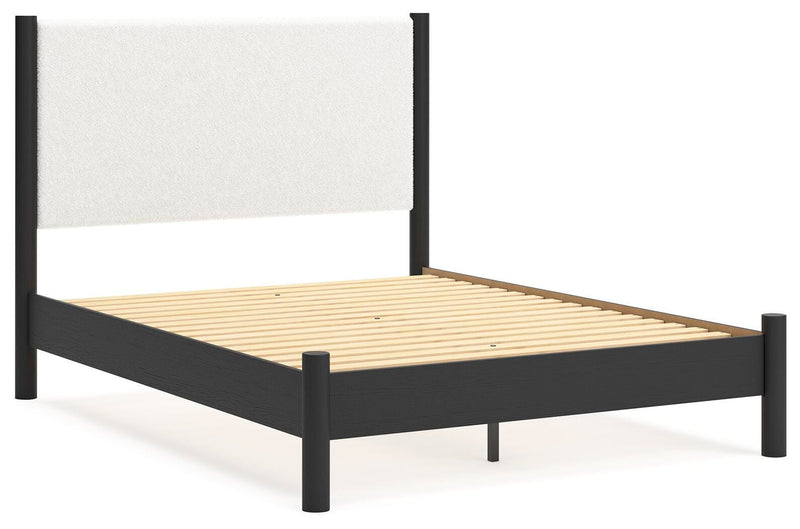 Ashley Furniture Cadmori Bedroom Set featuring a bed, nightstands, and dresser in a modern bedroom layout.