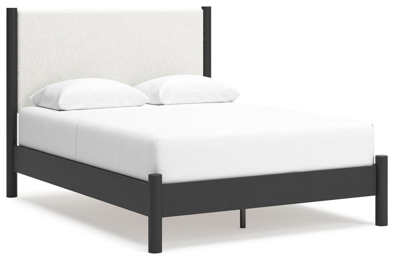 Ashley Furniture Cadmori bedroom set with a bed, nightstands, and dresser in a modern bedroom scene.