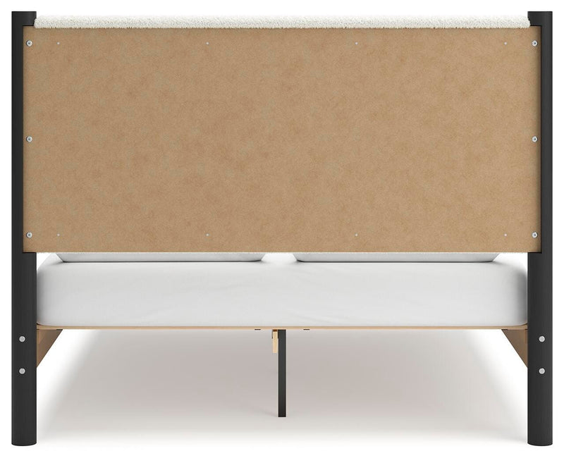 Ashley Furniture Cadmori bedroom set with a modern bed frame, matching nightstands, and a coordinated dresser in a stylish bedroom.