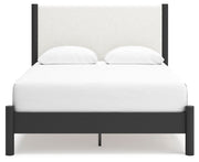 Ashley Furniture Cadmori bedroom set featuring a bed with a headboard and matching bedroom furniture in a modern design.