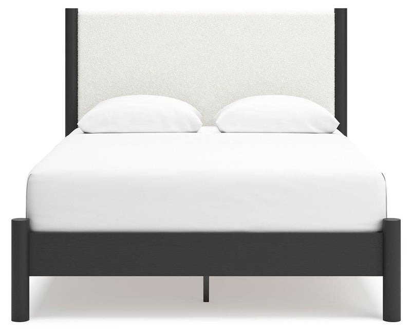 Ashley Furniture Cadmori bedroom set featuring a bed with a headboard and matching bedroom furniture in a modern design.