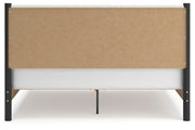 Ashley Furniture Cadmori upholstered bed with headboard and neutral fabric, shown in a well-lit bedroom setting.