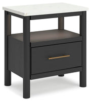 Ashley Furniture Cadmori bedroom set featuring a bed, nightstands, and dresser in a modern design, shown from an angled view.