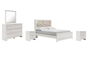 Ashley Furniture Altyra bedroom set with a bed, matching nightstands, and dresser in a modern bedroom style.