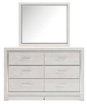Altyra dresser and mirror by Ashley Furniture showing a sleek wooden dresser with matching mirror in a modern bedroom setting.