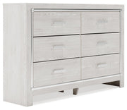 Ashley Furniture Altyra dresser with matching mirror, showcasing a modern wooden bedroom storage set, angled view.