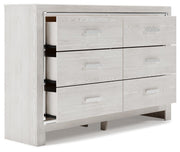 Open-angle view of the Ashley Furniture Altyra Dresser with multiple drawers and modern design, in a well-lit room setting.