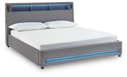 Ashley Furniture Verishaw upholstered bed with a padded headboard and sleek design, shown from a side angle.