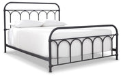 Ashley Furniture Nashburg Queen Mattress Set with matching bed frame and bedding, angled view showcasing the elegant bedroom design.