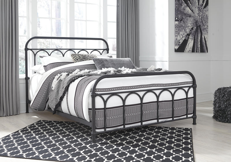 Ashley Furniture Nashburg Queen Bedroom Set mattress with matching bed frame and bedding in a modern bedroom setting.