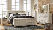 Ashley Furniture Bellaby bed with two storage drawers, showcasing a sturdy wooden frame and built-in under-bed storage.