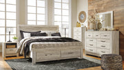 Ashley Furniture Bellaby bed with two storage drawers, showcasing a modern bed frame with sleek design and storage space.