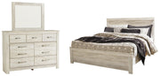 Ashley Furniture Bellaby bedroom set with a bed, nightstands, and dresser in a modern design, shown in a cozy bedroom setting.
