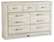 Ashley Furniture Bellaby Dresser with sleek wood finish and multiple drawers for ample storage.