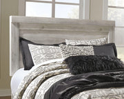 Ashley Furniture Bellaby bed with two storage drawers, featuring a modern design and sturdy wooden frame in natural finish.
