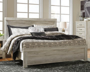 Ashley Furniture Bellaby bedroom set with a wooden bed frame, matching nightstands, and a cozy, stylish bedroom arrangement.