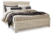 Ashley Furniture Bellaby bedroom set with a dark wood finish, including a bed frame, dresser, and nightstands.