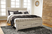 Ashley Furniture Bellaby bed with two storage drawers, showcasing a stylish wooden bed frame with built-in storage in a cozy bedroom setting.