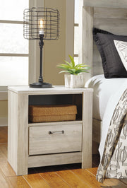 Ashley Furniture Bellaby bedroom set includes a bed frame, nightstands, and dresser with a modern wood finish.