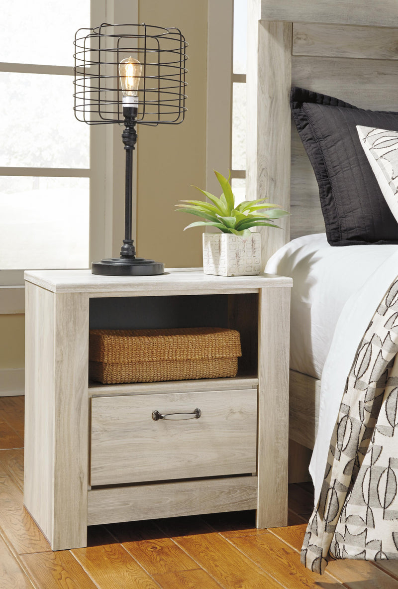 Ashley Furniture Bellaby bedroom set includes a bed frame, nightstands, and dresser with a modern wood finish.