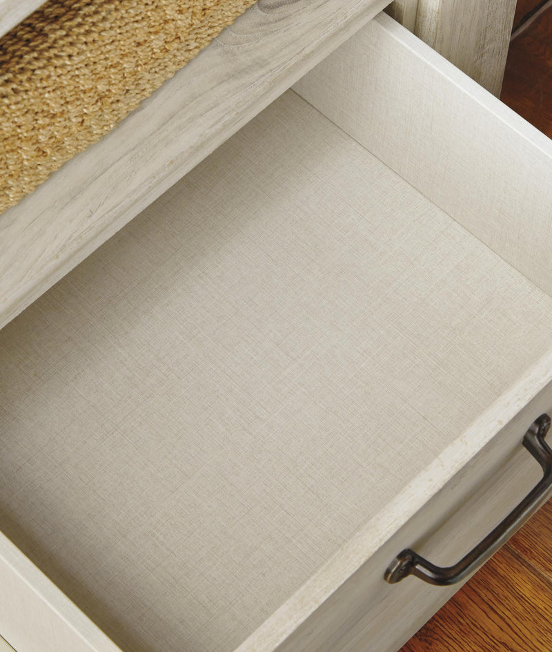 Ashley Furniture Bellaby nightstand with wood finish and sleek design, featuring a drawer and open shelf for bedside storage.