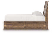 Ashley Furniture Chirason Bed with wooden frame and headboard, shown in a cozy bedroom setting.