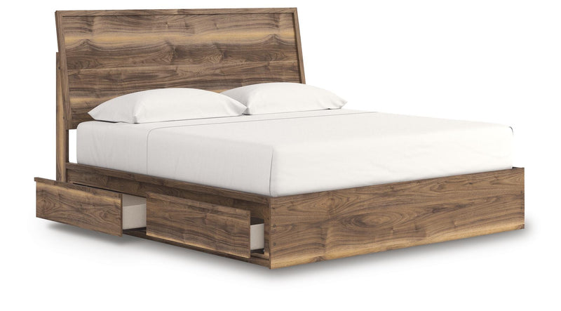 Ashley Furniture Chirason Bed with a polished wood frame and detailed headboard, shown from an angled open view.