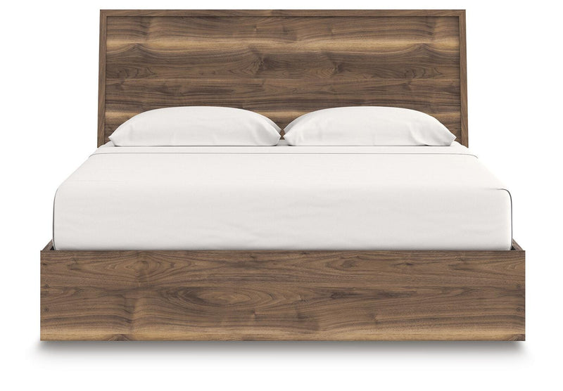 Ashley Furniture Chirason Bed with a modern headboard, showcasing a stylish wooden bed frame in a contemporary bedroom setting.