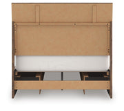 Ashley Furniture Chirason Bed with upholstered headboard and wooden frame, shown in a stylish bedroom setting.