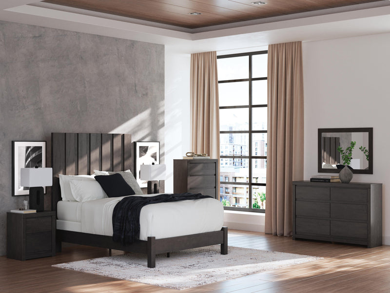 Ashley Furniture Fraluna dresser with multiple drawers, finished in a warm wood tone, featuring sleek metal handles.