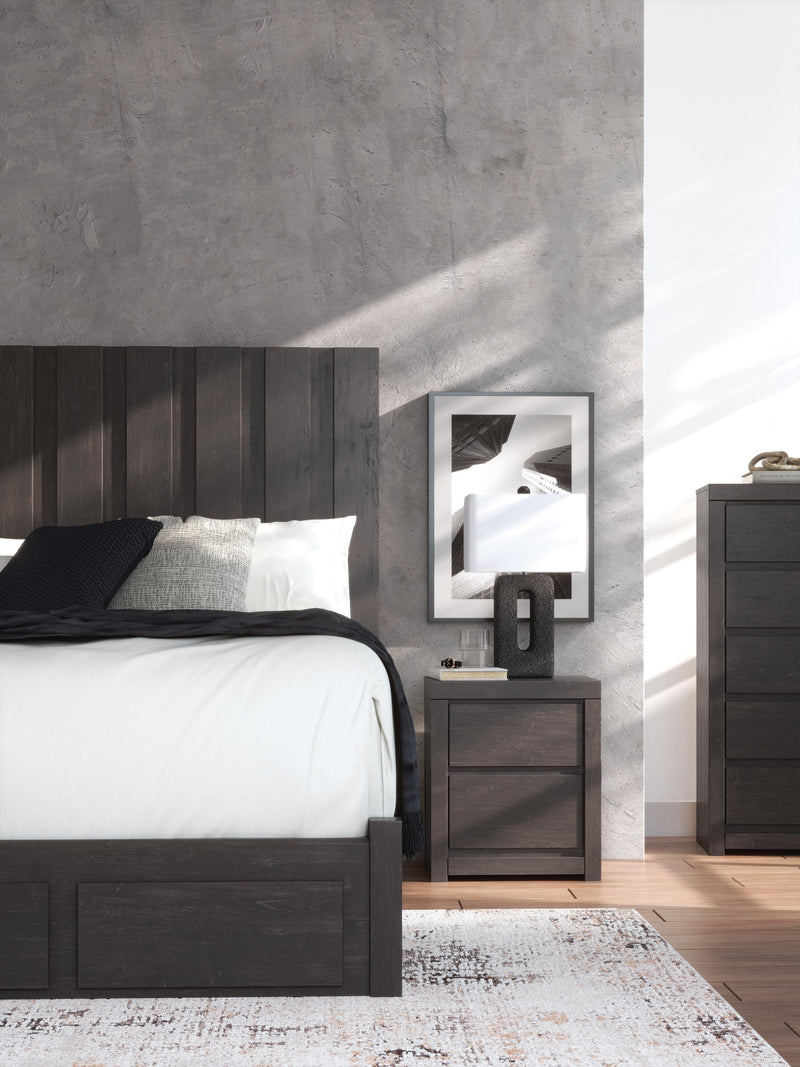 Ashley Furniture Fraluna nightstand with a sleek wooden finish and modern design, featuring drawer handles and a spacious top surface.