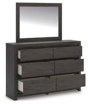 Ashley Furniture Fraluna bedroom set with a bed, nightstands, and dresser in a modern design, shown from an angled open view.