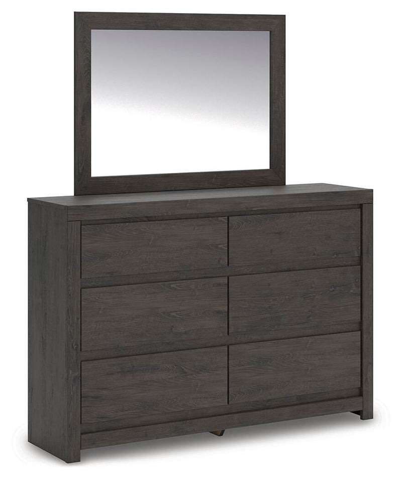 Ashley Furniture Fraluna bedroom set with a bed, nightstands, and matching dresser in a modern bedroom scene.