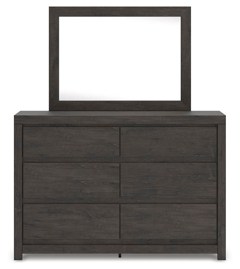Ashley Furniture Fraluna bedroom set, headboard detail with wood finish and modern design in a cozy bedroom setting.