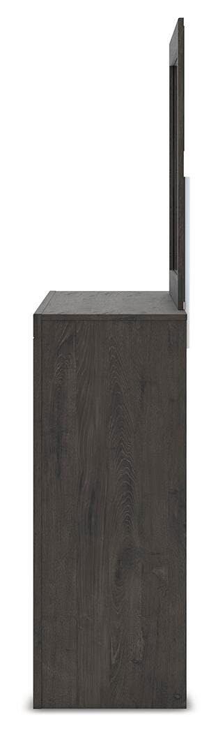 Ashley Furniture Fraluna bedroom set with a modern bed frame, matching nightstands, and stylish decor in a cozy bedroom setting.