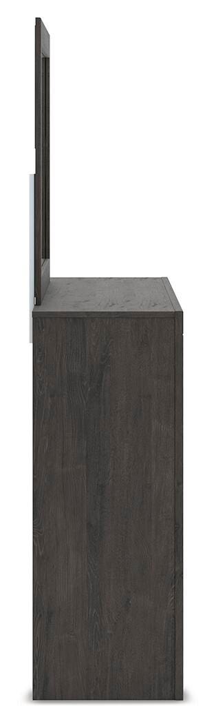 Ashley Furniture Fraluna bedroom set with a modern bed, matching nightstands, and elegant design in a cozy bedroom scene.