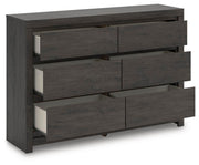 Open-angle view of the Ashley Furniture Fraluna dresser showing multiple drawers and modern wood finish.