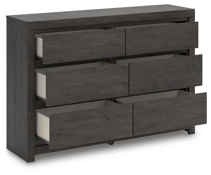 Open-angle view of the Ashley Furniture Fraluna dresser showing multiple drawers and modern wood finish.