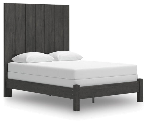 Ashley Furniture Fraluna Bed with a modern design, shown from an angled view highlighting its stylish frame and plush headboard.