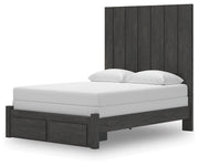 Ashley Furniture Fraluna bedroom set with a bed, nightstands, and dresser, shown from an angled view in a stylish bedroom setting.